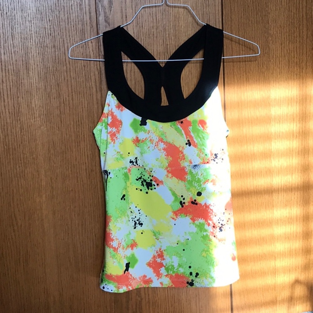Ladies green, coral, yellow and black tank top with built in bra. Size medium.